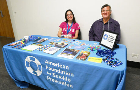 two people at american foundation for suicide prevention table