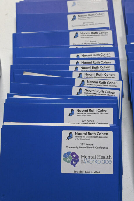 blue conference folders with NRCI logo