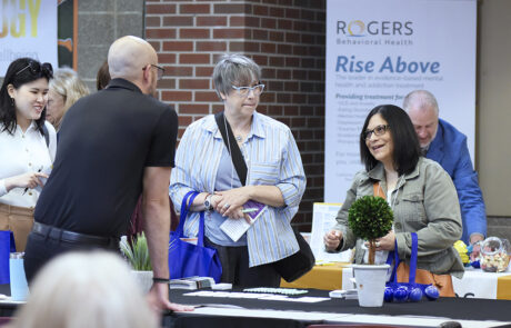 woman talking to a man at a display table