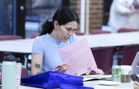 woman reading through papers
