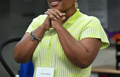 woman in lime green vertically striped dress