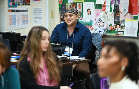 person with colorful bandana and dark blue shirt
