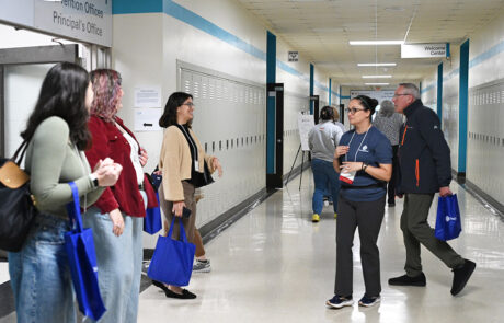 people entering a hallway at a school